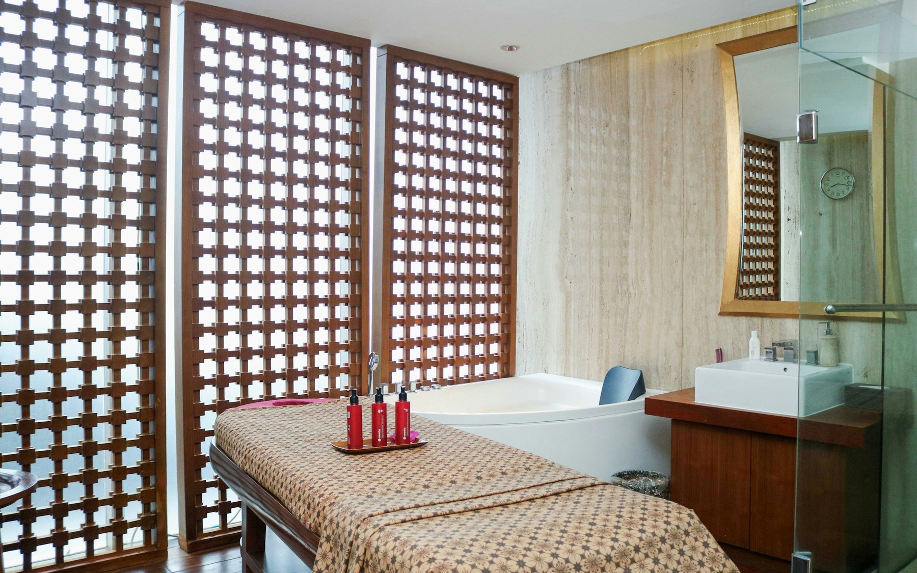 Beautiful spa room with massage bed